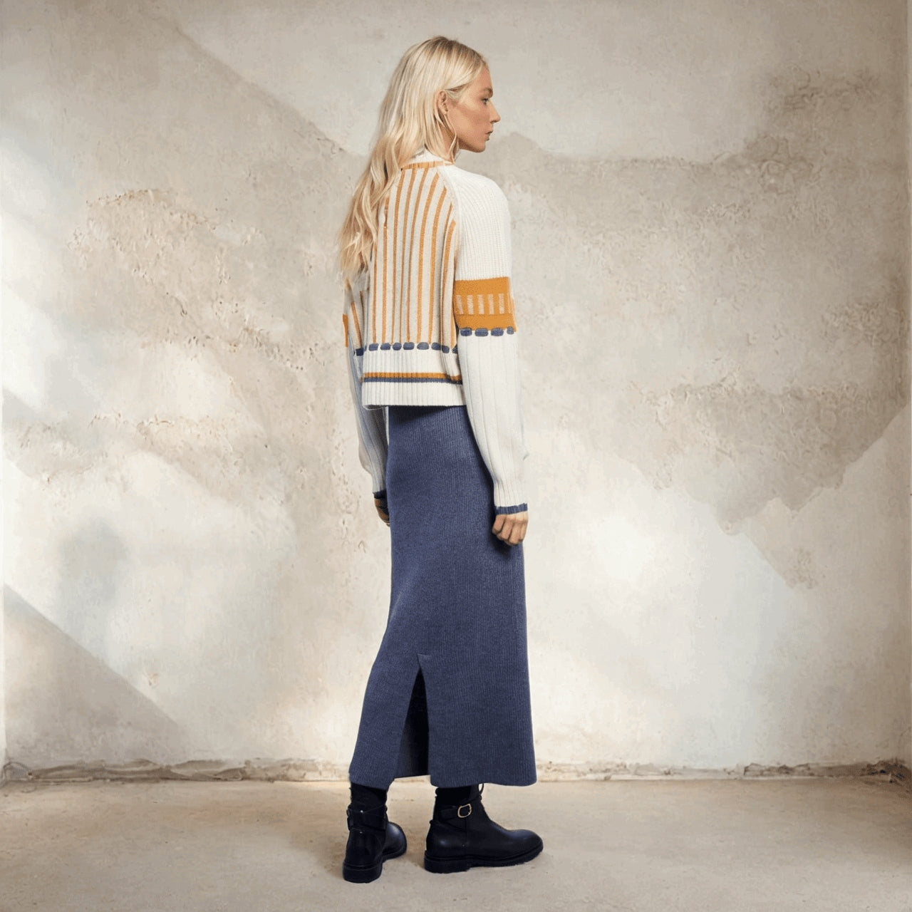 Cashmere mixed knit round neck with orange stripe and cream color.