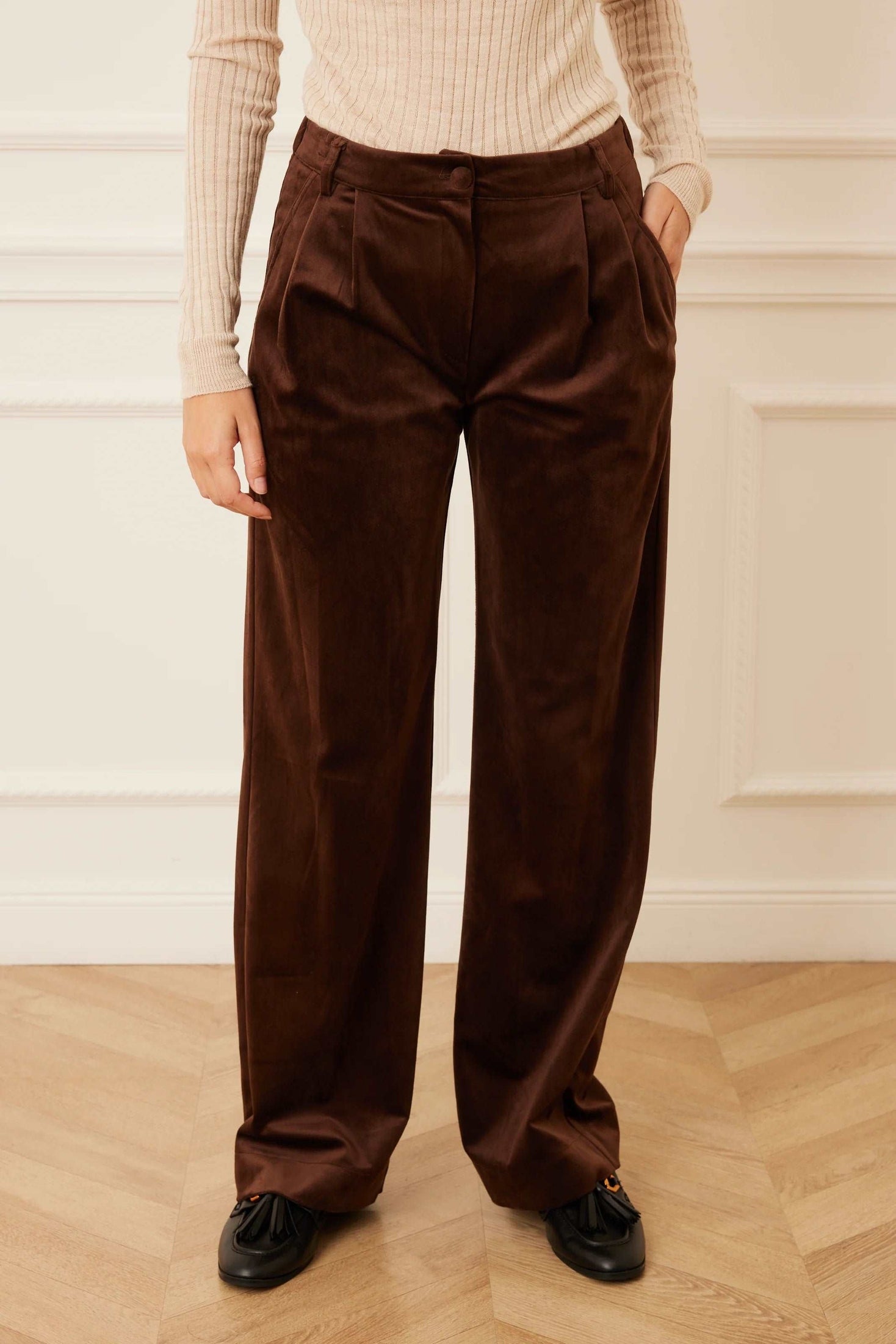 Front view of brown velour pants.